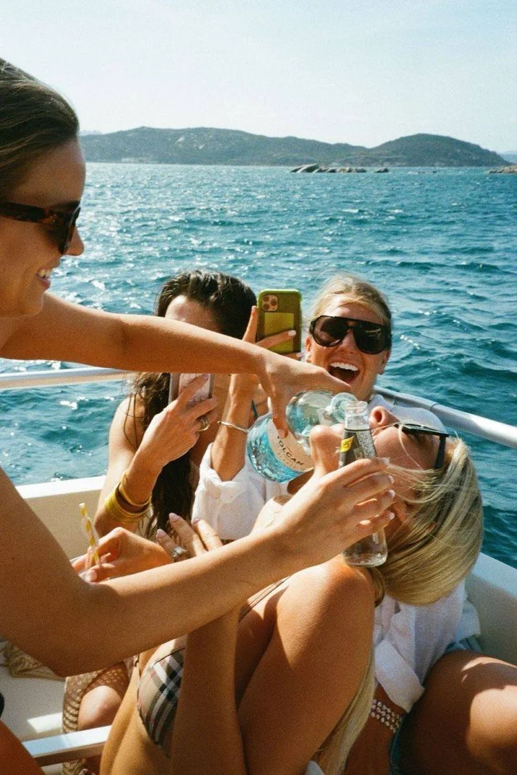 Women celebrating on a boat